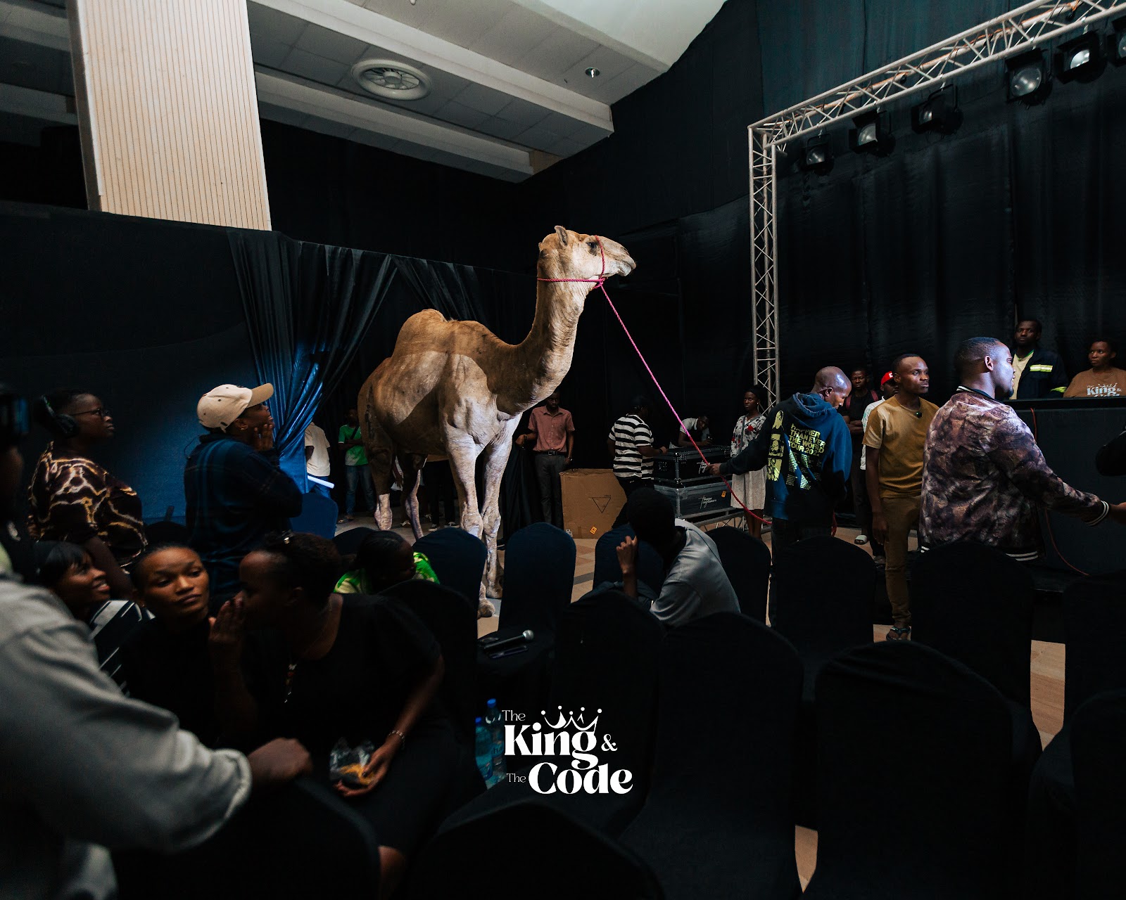 The cast and crew backstage with Junior the camel